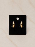Majesty Mini Earrings displayed on black card, featuring a sleek dome silhouette in polished gold finish.