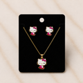 The Charme' Kitty Legacy Set jewelry collection featuring gold-tone necklace and earrings with charm designs.