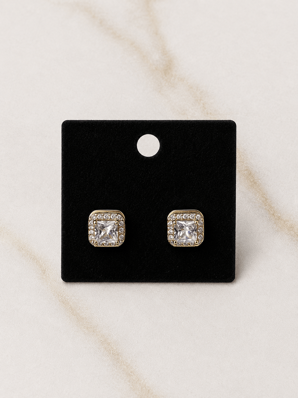 The Reign Diamond Studs featuring a stunning diamond-studded design for an elegant touch of luxury.