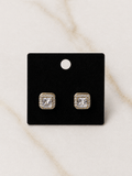 The Reign Diamond Studs featuring a stunning diamond-studded design for an elegant touch of luxury.