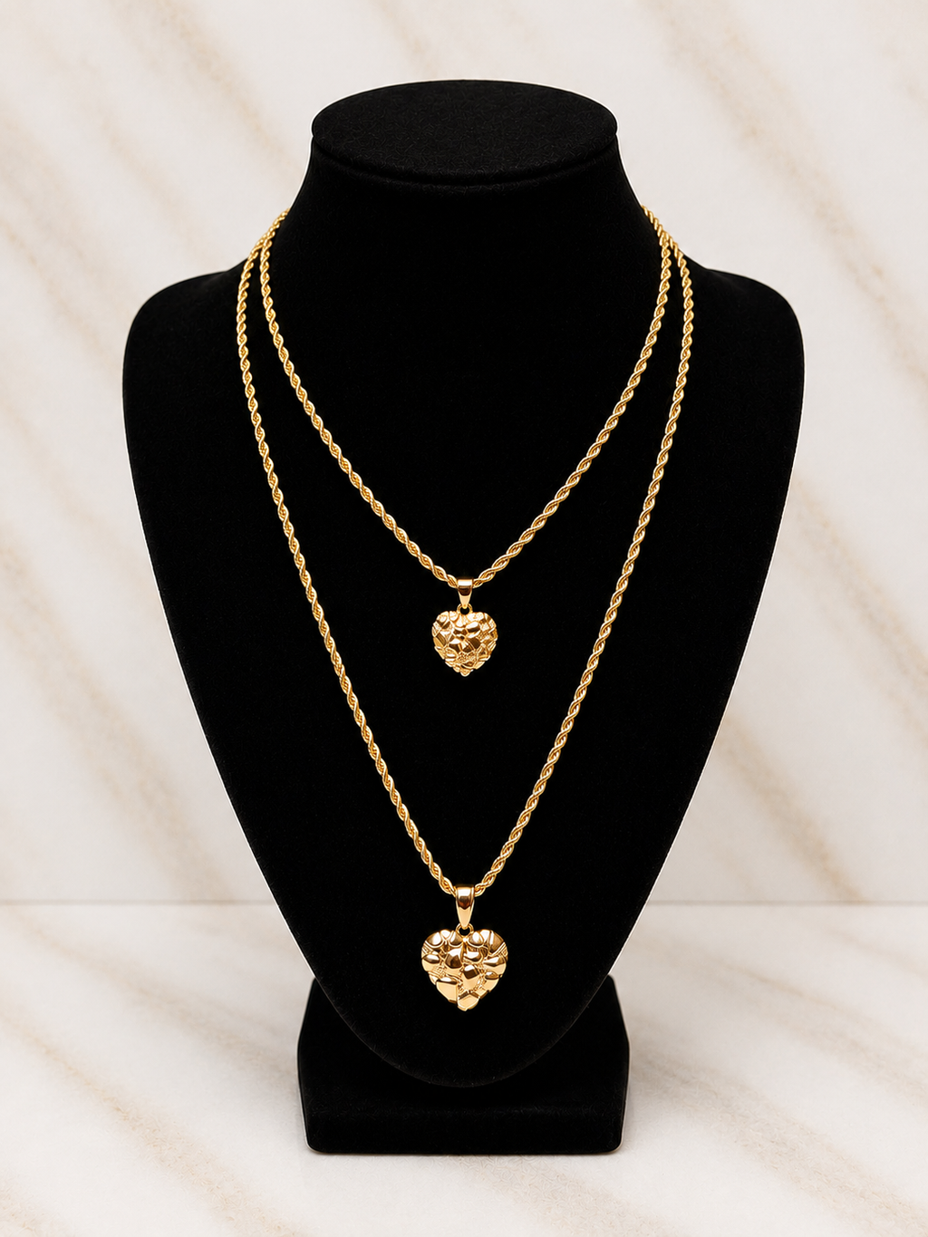 Gold double heart necklace displayed on black bust, a perfect Gift for Mother from Daughter.
