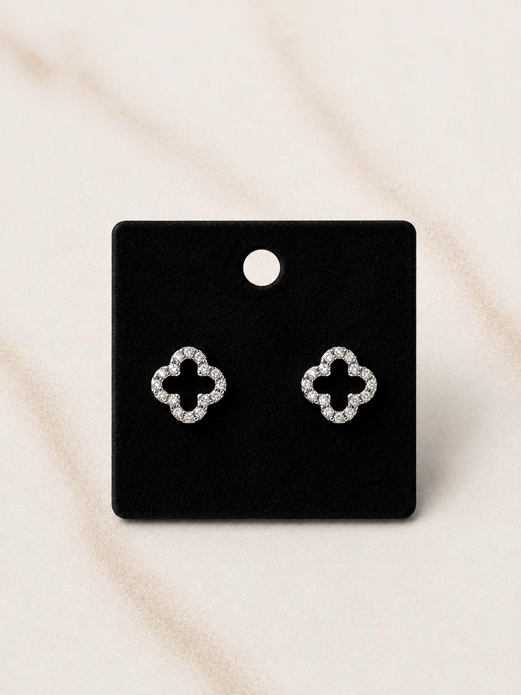 The Evermore Clover Earrings showcase a delicate clover design with sparkling details, perfect for timeless elegance.